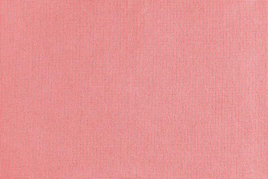 Texture background of red cotton fabric. Textile structure, cloth surface, weaving of linen fabric closeup, backdrop, wallpaper.