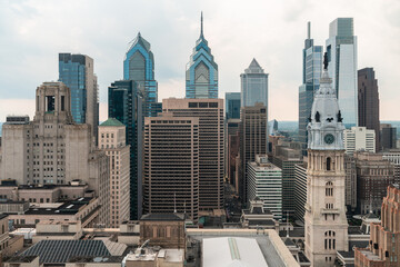 Fototapeta premium Aerial panoramic cityscape of Philadelphia financial downtown, Pennsylvania, USA. Philadelphia City Hall Clock Tower. A vibrant business and cultural neighborhoods.