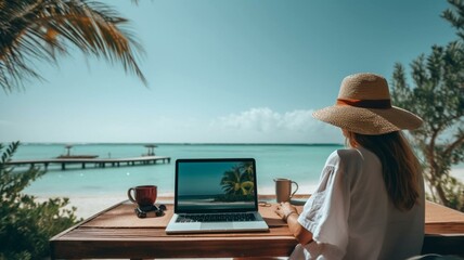 person working on laptop at the beach - obrazy, fototapety, plakaty