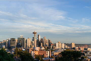 Fototapeta na wymiar Seattle skyline panorama with iconic view observation tower as seen from Kerry Park. Skyscrapers of financial downtown at sunset, Washington, USA. A vibrant business neighborhood