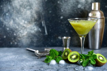 Kiwi cocktail with mint in a martini glasses.