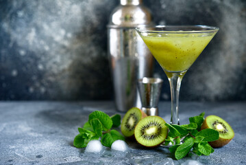 Kiwi cocktail with mint in a martini glasses.