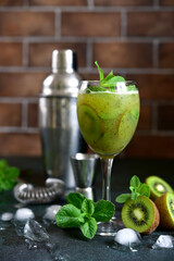 Kiwi cocktail with mint in a martini glasses.