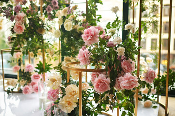wedding arch of peonies and roses without people. Modern wedding decoration