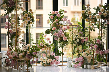 Fototapeta na wymiar wedding arch of peonies and roses without people. Modern wedding decoration