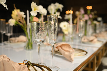 beautiful elegant decor of flowers and elegant serving on the wedding table. Modern wedding decoration