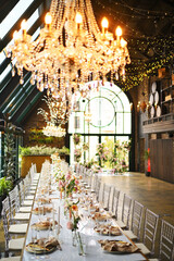 beautiful elegant decor of flowers and elegant serving on the wedding table. Modern wedding decoration