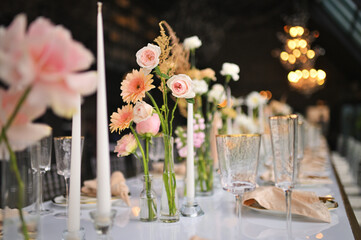 beautiful elegant decor of flowers and elegant serving on the wedding table. Modern wedding decoration