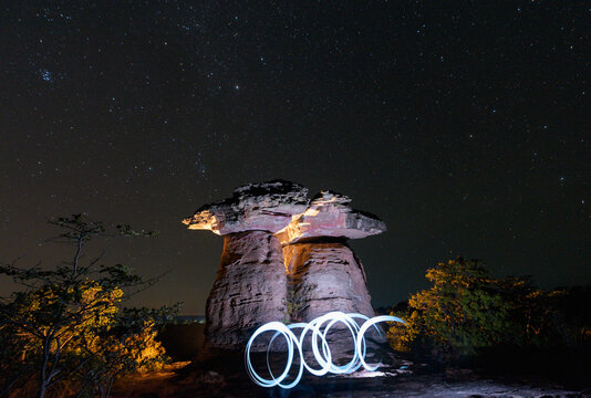 Lights in front of Dramatic rock formations at night, Sam Pan Bok, Ubon Ratchathani, Thailand