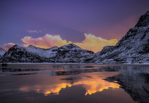Coastal snow covered mountain landscape, Skagen Beach near Ramberg, Flakstad, Lofoten, Nordland, Norway