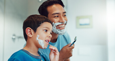 Dad, boy and learning to shave in bathroom with facial cream, skincare routine and support. Father, kid and teaching about cosmetics of cleaning face, beard and foam for love, care and family at home