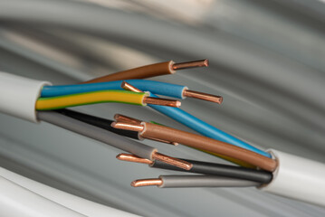 Close-up three-phase electric cables used to installation in commercial and industrial electrical systems