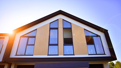 New build single family house. Suburban area with modern geometric family house.