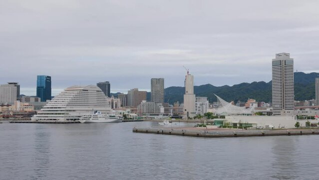 Coast Guard patrol boat sails by Sannomiya tower buildings
