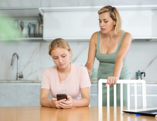 Mother is outraged by childs long screen time. Woman screams and swears at teenager for aimlessly...