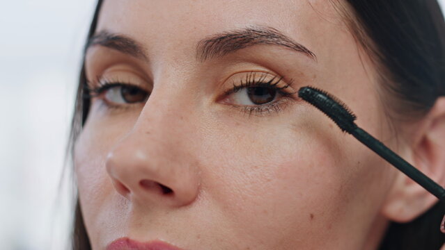 Closeup Lady Applying Eyelashes Mascara Makeup Indoors. Pov Serious Woman Visage