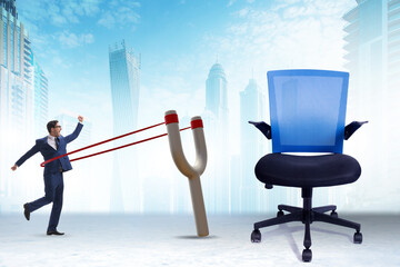 Career concept with businessman launched from slingshot