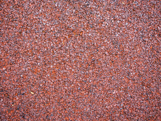 Brown texture. Polymer background. The surface of the playground. Ground for playing. Safe surface.
