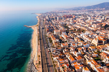 Aerial view of residential areas and the coast of the small Catalan town of Vilasar de Mar, Spain