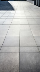 Texture of a modern concrete sidewalk with large rectangular tiles, each with a glossy sheen and a neutral grey color. The surface is smooth and even, providing a sleek and polished look.