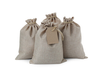 Many tied burlap bags isolated on white