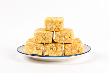 Chinese traditional dessert caramel treats or sachima isolated on white background.