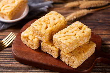 Chinese traditional dessert caramel treats or sachima on table.