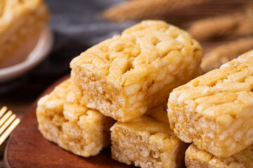 Chinese traditional dessert caramel treats or sachima on table.