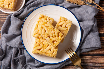 Chinese traditional dessert caramel treats or sachima on table.