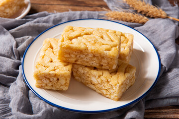 Chinese traditional dessert caramel treats or sachima on table.