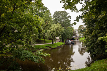 Panorama of the pilsetas kanals (the riga city canal) in the Bastejkalns Park during a grey afternoon. It's a city park in Riga, Latvia, surrounding the center of the historical city.
