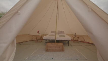 Wide shot of bell tent entrance