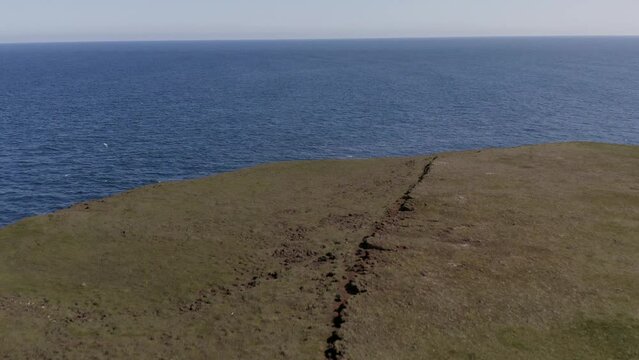 Fontur Lighthouse Overlooking The Calm Sea In Daytime In Langanes Peninsula, Iceland. - aerial