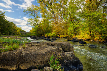 A river landscape of rock formations on the Haw River in the forest in North Carolina.