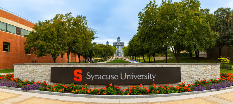 Panoramic image of Syracuse University campus with sign.