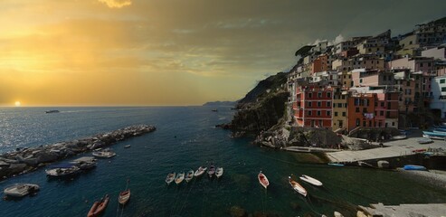 Fototapeta na wymiar Beautiful sunset at Riomaggiore one of the 5 villages in beautiful Cinque Terre region of Italy