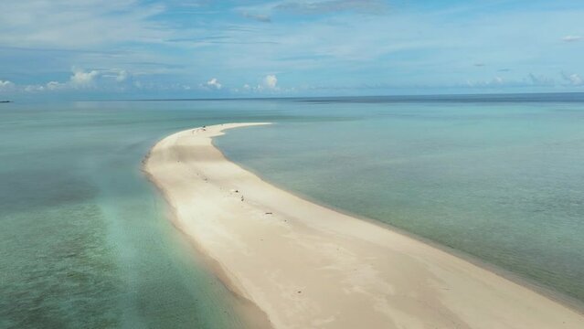 Sandy beach with crystal clear water in the tropics. Timba Timba islet. Tun Sakaran Marine Park. Borneo, Sabah, Malaysia.