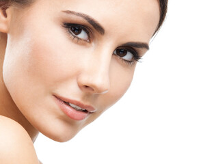 Fototapeta premium Face portrait photo of beautiful young woman, isolated over white background. Studio image of brunette beauty girl looking at camera.