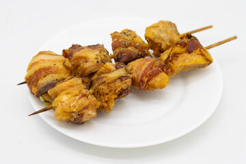 Greek Kotobacon Souvlaki Skewers on a White Plate