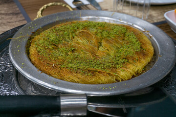 Turkish dessert baklava with pistachio powder on top