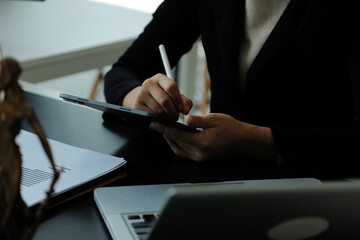 Judge gavel with Justice lawyers having team meeting at law firm in background. Concepts of law.