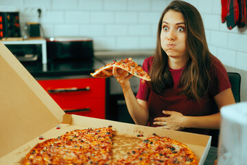 Woman Feeling Full After Eating From a Slice of Pizza. Girl having no appetite feeling discomfort...