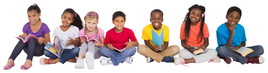 Digital png photo of happy diverse schoolchildren sitting with books on transparent background - Powered by Adobe