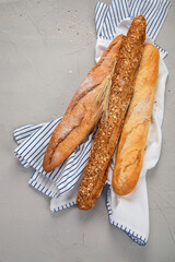 Fresh baguette bread on light background. Traditional French food