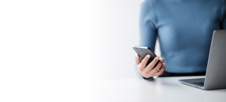 Businesswoman hands using smartphone mockup at the white office
