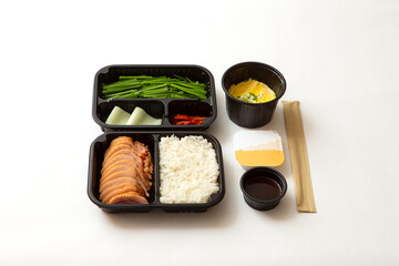 Stir-fried meat and side dishes in packaging containers, Korean food