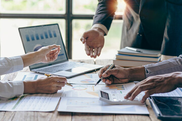 Investors, businessmen meeting to discuss stock statistics, summary graph analysis, business expense reports. and working information regarding the company's financial statements