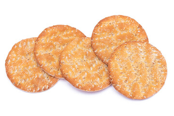 A Heap of Round Salt Crackers with Sesame Isolated on White Background. Dry Snacks - Isolation