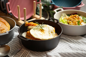 Salad, bread and various foods on the table	