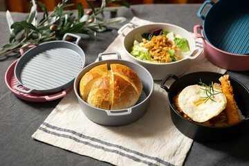 Salad, bread and various foods on the table